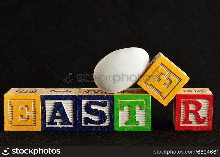 Easter spelled with alphabet blocks and a easter egg