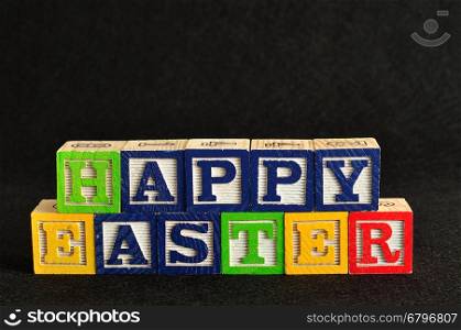 Easter spelled with colorful alphabet blocks