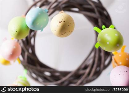 Easter wreath with color eggs on ribbons. Easter wreath