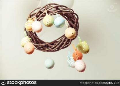 Easter wreath with color eggs on ribbons. The Easter wreath