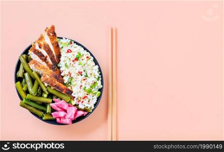 Eastern cuisine. Japanese style grilled chicken rice, ready to eat, laid out against a bright background. Juicy chicken teriyaki sauce framed in a simple concept.