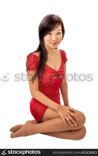 Eastern girl sitting on the floor in the red dress