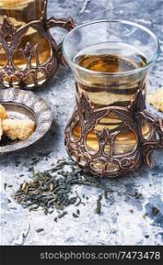 Eastern tea in traditional glasse.Eastern tea concept. Turkish tea in traditional glass
