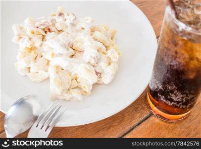 Easy meal with macaroni cheese and cola, stock photo