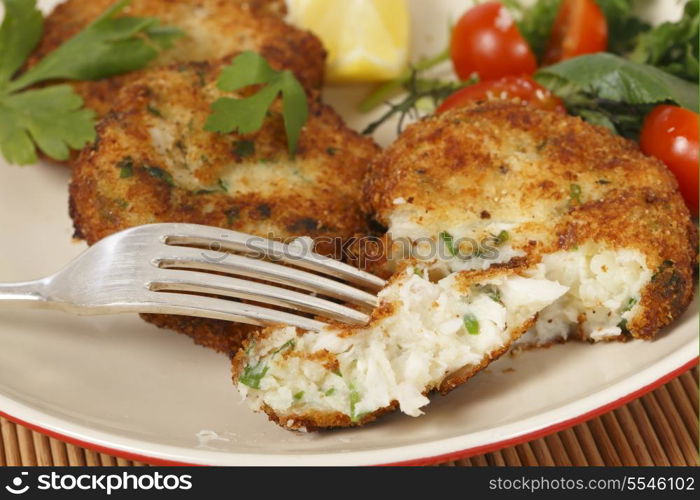 Easy to make fishcakes, with steamed fish crumbled into mashed potato and parsley mix, thickened with some flour, rolled in breadcrumbs and fried, served with a salad.