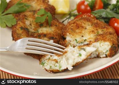 Easy to make fishcakes, with steamed fish crumbled into mashed potato and parsley mix, thickened with some flour, rolled in breadcrumbs and fried, served with a salad.