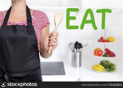 eat cook holding wooden spoon background concept.. eat cook holding wooden spoon background concept