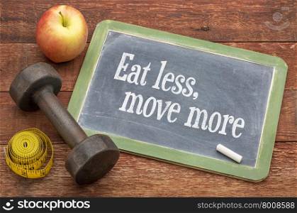Eat less, move more fitness and healthy living concept - slate blackboard sign against weathered red painted barn wood with a dumbbell, apple and tape measure