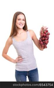 Eat more fruit!. Young woman holding a bunch of fresh grapes, isolated over white background
