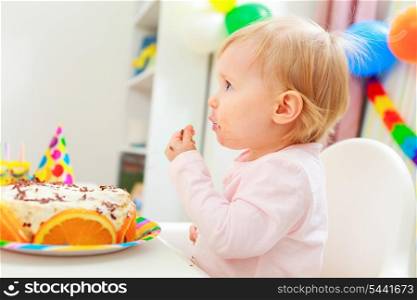 Eat smeared kid eating birthday cake