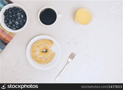 eaten donut coffee juice blueberries isolated white background