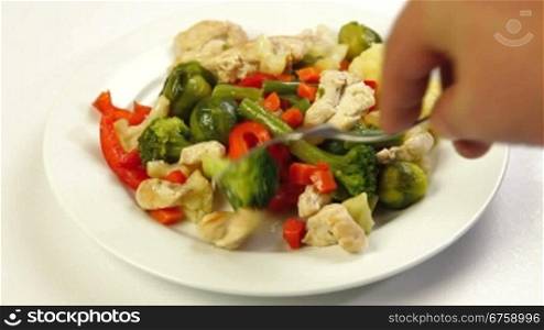 Eating Chicken and Vegetable Stir Fry