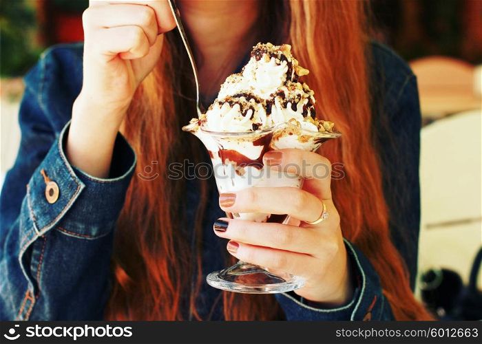 eating dessert close up. woman tasting creamy dessert