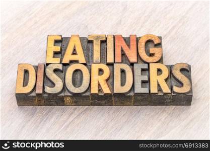 eating disorders word abstract in vintage letterpress wood type printing blocks