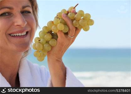 Eating grapes by the sea