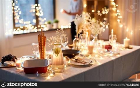 eating, holiday and celebration concept - dinner party table serving at home. dinner party table serving at home