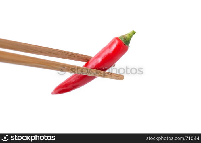 eating red hot pepper with chopsticks isolated on white background