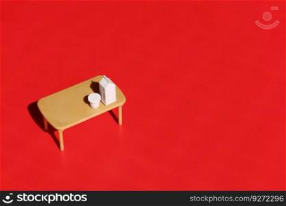 Eating table on red background. Conceptual