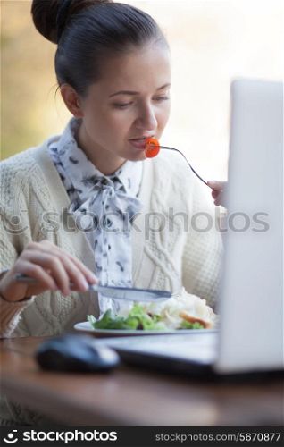 Eating woman during lunch break