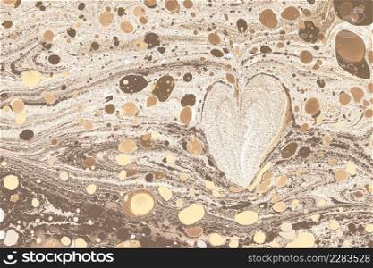 Ebru marbling background with heart shape.
