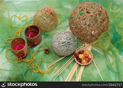 Eco composition of thread balls, candles and wooden basket