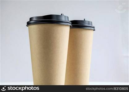 Eco friendly brown cup,Takeaway paper coffee cup isolated on white background. Zero waste and ecology concept. eco-friendly disposable brown paper cup mock up design close up. Eco friendly brown cup,Takeaway paper coffee cup isolated on white background. Zero waste and ecology concept. eco-friendly disposable brown paper cup mock up design