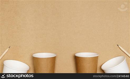 Eco friendly concept, Consist of paper cup and pencil with cotton buds on wooden background.