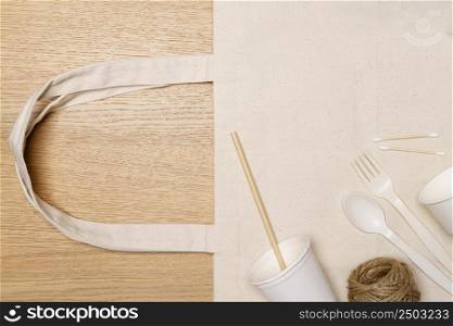 Eco friendly concept, Eco bag with food container and jute rope on wooden background.