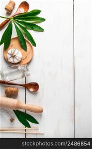 Eco-friendly recyclable products on white wooden background. Plastic-free kitchen accessories. Place for text.. Eco-friendly recyclable products on white wooden background. Plastic-free kitchen accessories.