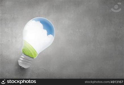 Eco life!. Close up of light bulb and ecology concept in it