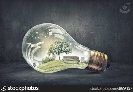 Eco life. Eco life and energy saving concept in glass light bulb