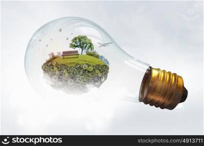 Eco life. Eco life and energy saving concept in glass light bulb