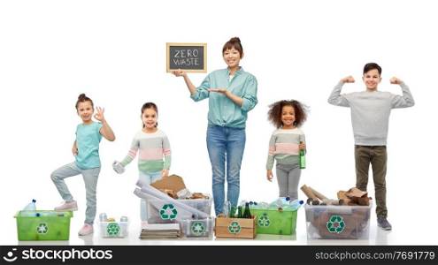 eco living and sustainability concept - happy smiling young asian woman holding chalkboard with zero waste words and children sorting plastic, glass paper, metal garbage in boxes over white background. happy woman with little children sorting waste