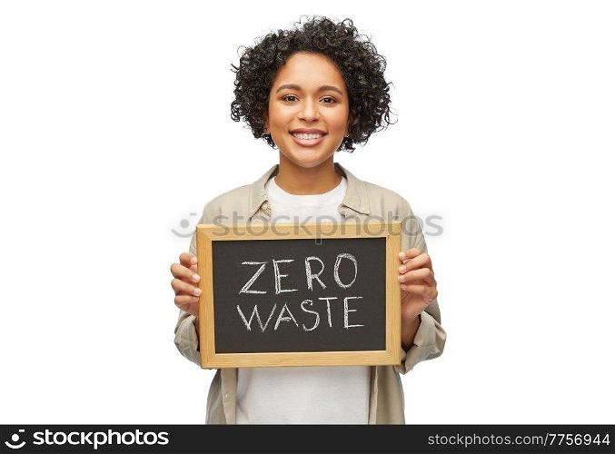 eco living, environment and sustainability concept - happy smiling woman holding chalkboard with zero waste words over white background. woman with zero waste words on chalkboard