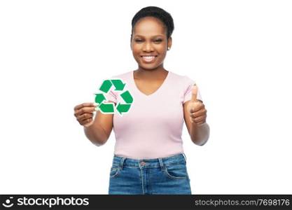 eco living, environment and sustainability concept - portrait of happy smiling young african american woman holding green recycling sign showing thumbs up over white background. smiling asian woman holding green recycling sign