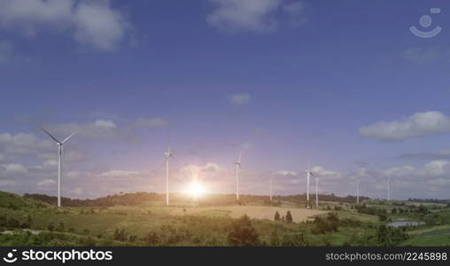 Eco power, landscape with hills and wind turbine field on sunset sky background.