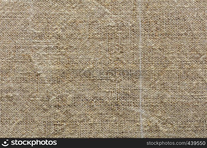 Ecological handmade and natural background and texture of fibre the fabric of hemp thread closeup. Background and texture of weave of eco-friendly old rough hemp