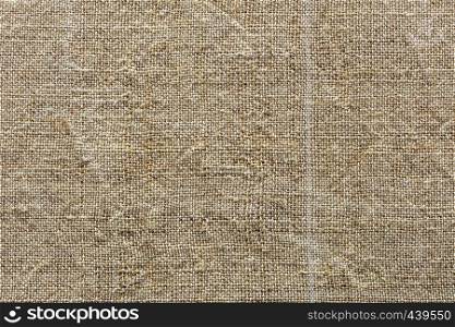 Ecological handmade and natural background and texture of fibre the fabric of hemp thread closeup. Background and texture of weave of eco-friendly old rough hemp