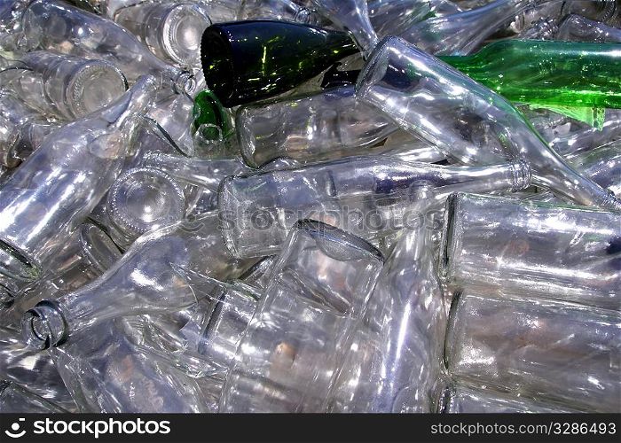ecological recycling glass bottles in messy container