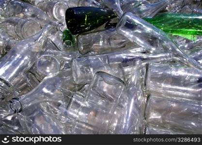 ecological recycling glass bottles in messy container