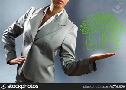 Ecology concept. Close up of businesswoman holding tree sketch in palm