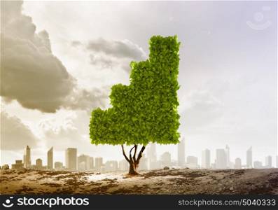Ecology concept. Plant in shape of graph against city background