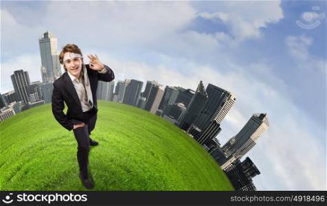 Ecology concept. Young cheerful businessman with tie around head