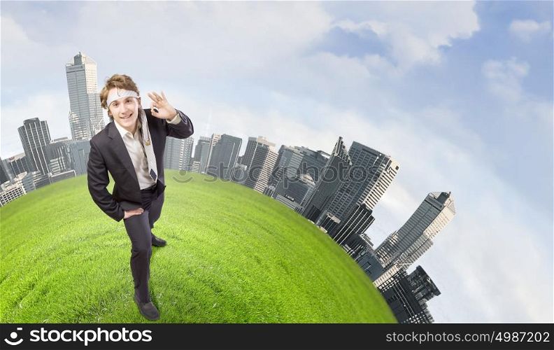 Ecology concept. Young cheerful businessman with tie around head