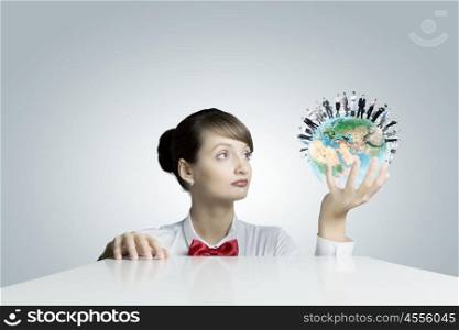Ecology concept. Young smiling woman holding Earth planet in hand. Elements of this image are furnished by NASA
