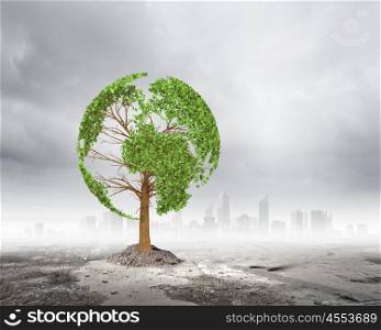 Ecology idea. Green tree shaped liked our Earth planet. Environmental concept