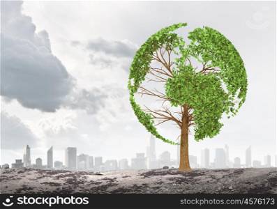 Ecology idea. Green tree shaped liked our Earth planet. Environmental concept
