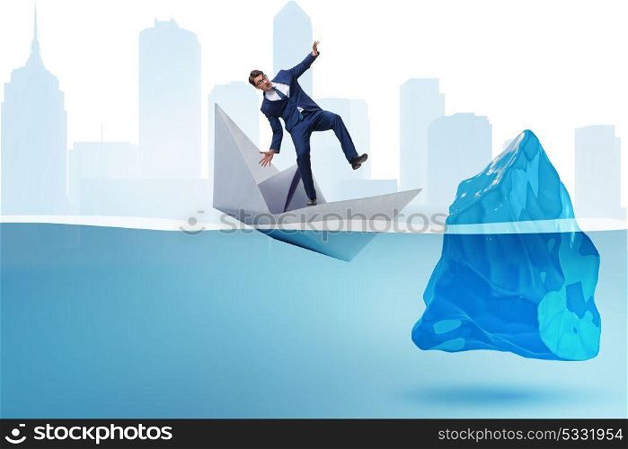 Economic crisis concept with businessman in sinking paper boat