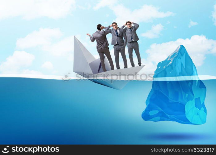 Economic crisis concept with businessman in sinking paper boat