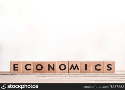 Economics sign made of blocks on a desk